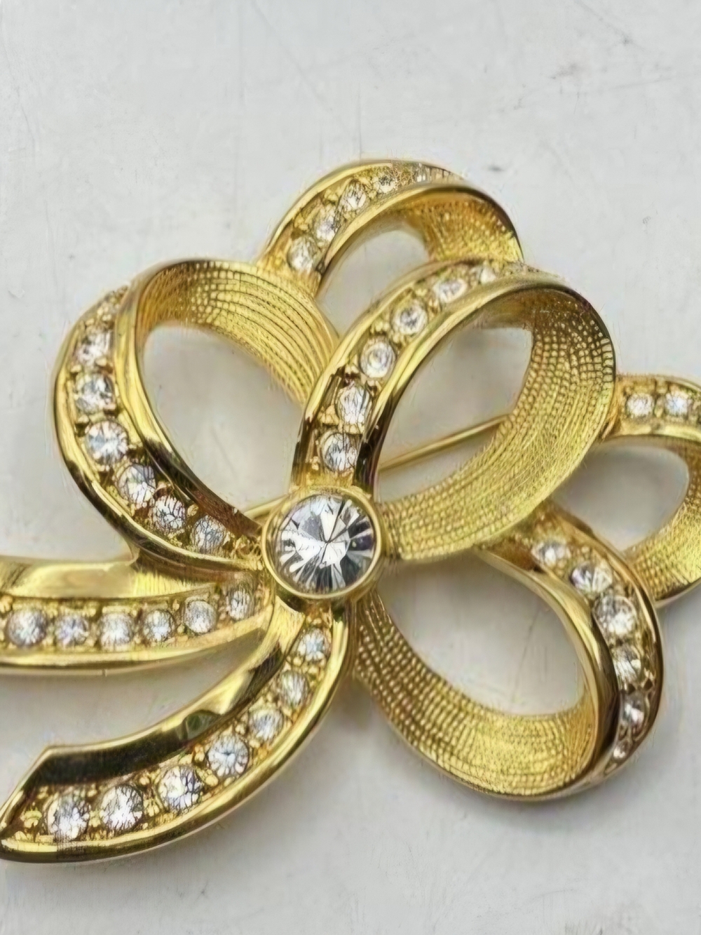 Kenneth Jay Lane Gold and Clear Crystal Ribbon Flower Brooch